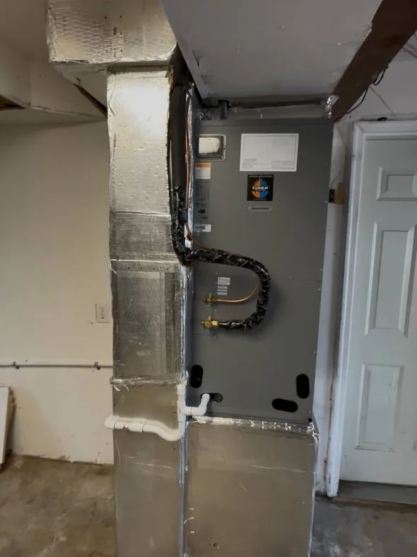 Air handler installed in a closet with conduit and line connections