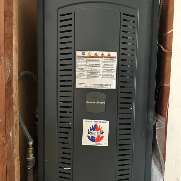 Air handler in a closet with the EverHeat Solutions label