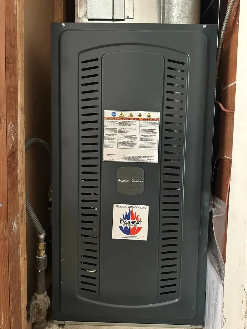 Air handler in a closet with the EverHeat Solutions label
