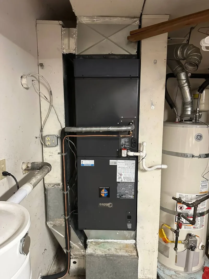 Air handler installed in a closet next to a water heater