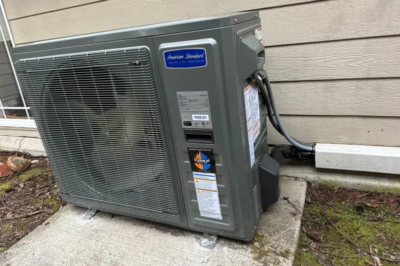 American Standard heat pump installed on a concrete pad