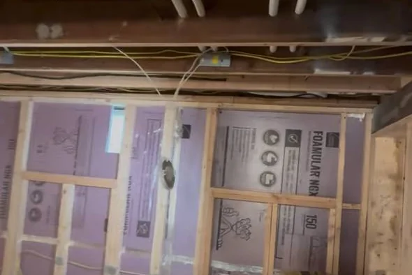 Piping and insulation in basement framing during an installation