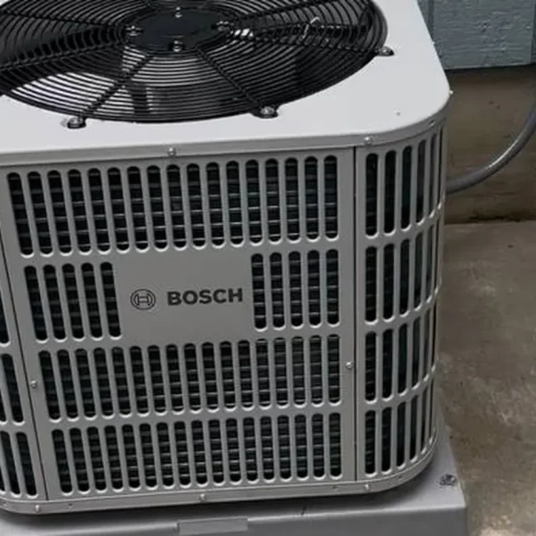 Bosch central air conditioner installed on a concrete pad