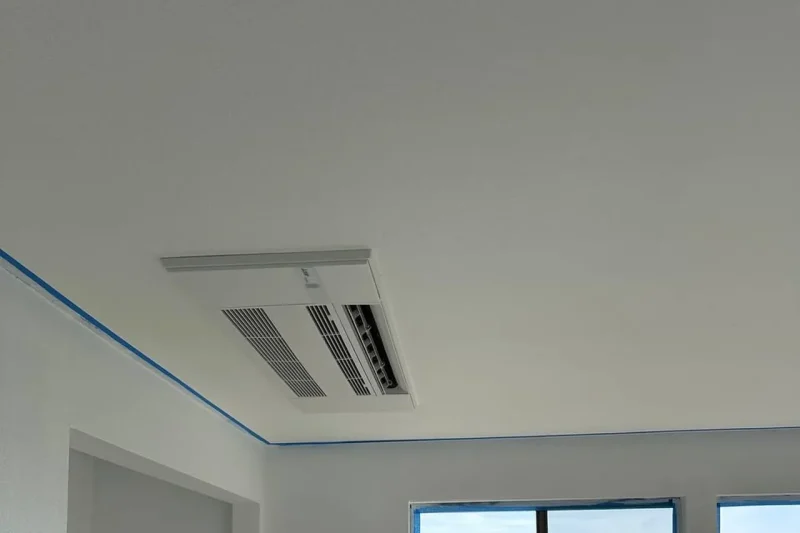 Ceiling cassette indoor unit in a room overlooking the water