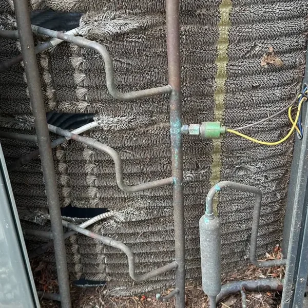 Open condenser coil and wiring during a repair