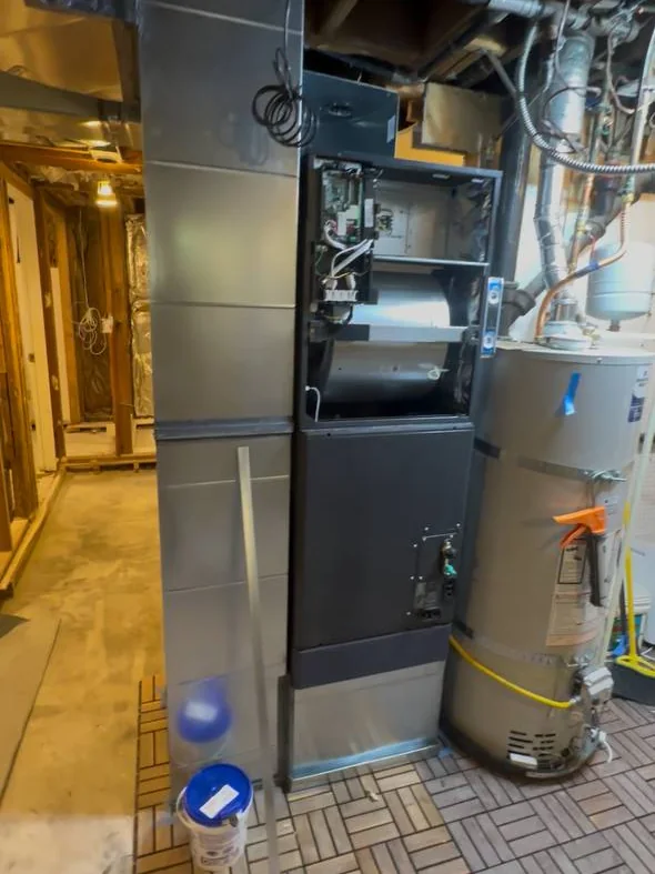 Furnace and water heater installed in a utility room
