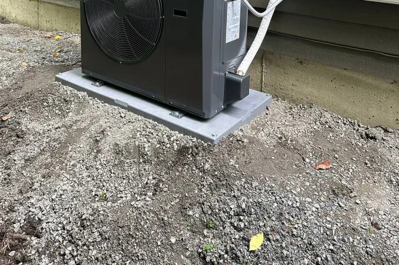 Midea heat pump outdoor unit installed on a composite pad