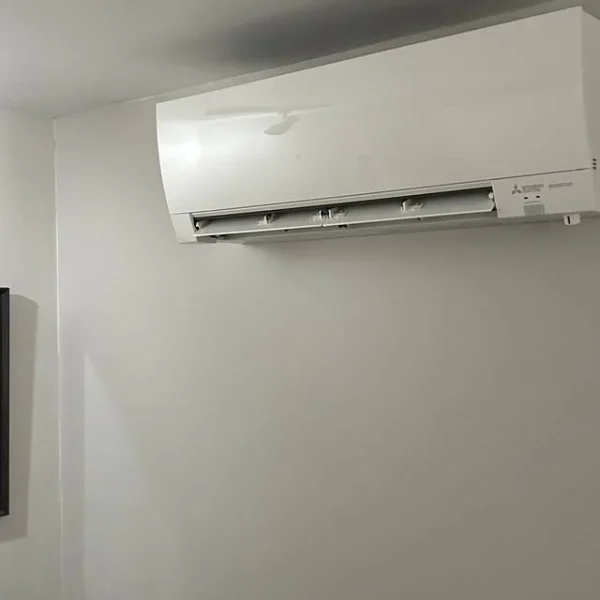 Ductless mini-split indoor head installed in a bedroom