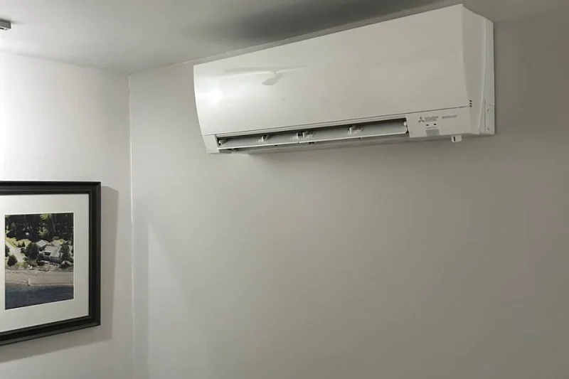 Ductless mini-split indoor head installed in a bedroom