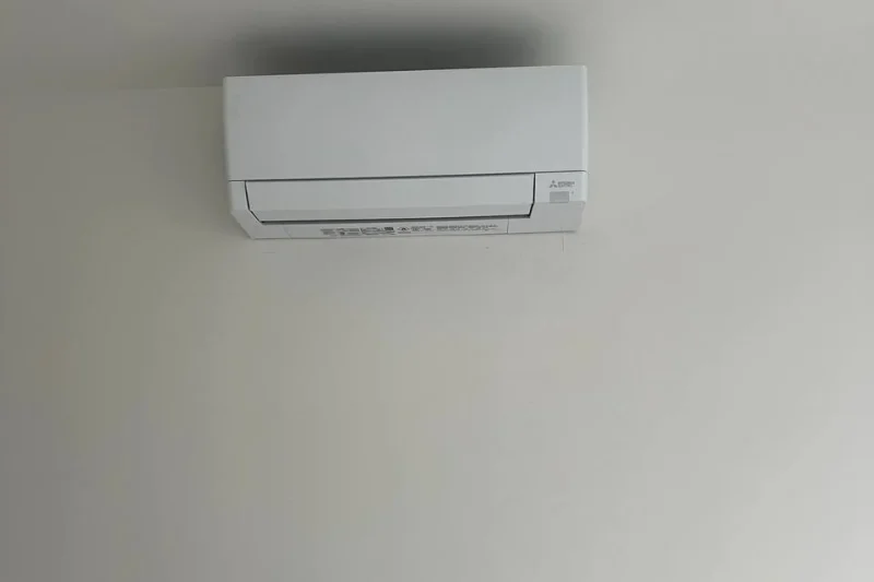 Ductless mini-split indoor head with a step ladder during installation