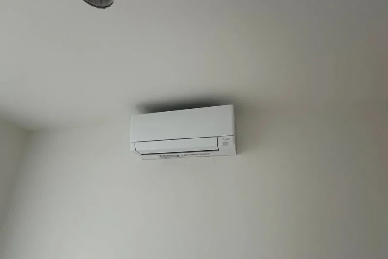 Ductless mini-split indoor head mounted high on a wall