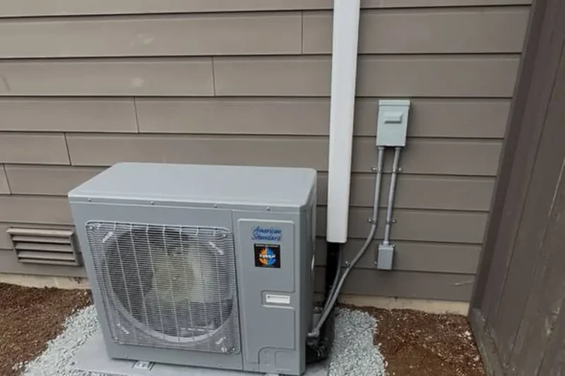 Mini-split outdoor unit installed on a gravel bed