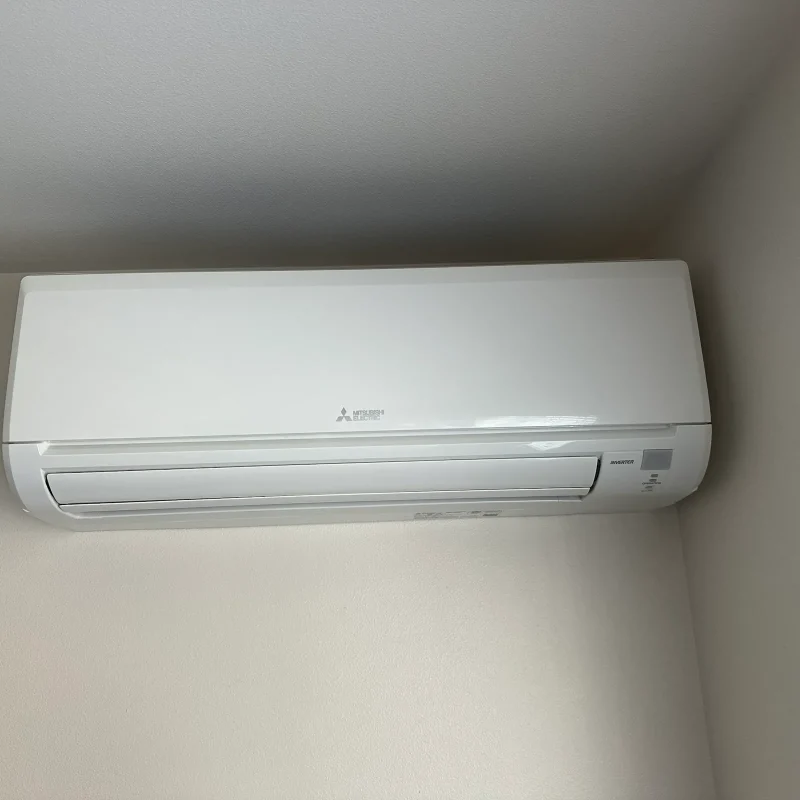 Mitsubishi mini-split indoor head on a plain interior wall