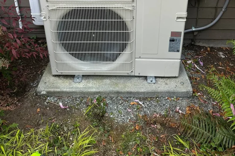 Mitsubishi Electric multi-zone heat pump installed beside a home
