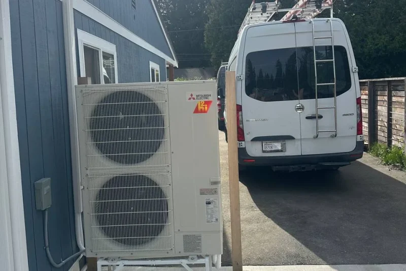 Mitsubishi Electric multi-zone outdoor unit with the service van behind