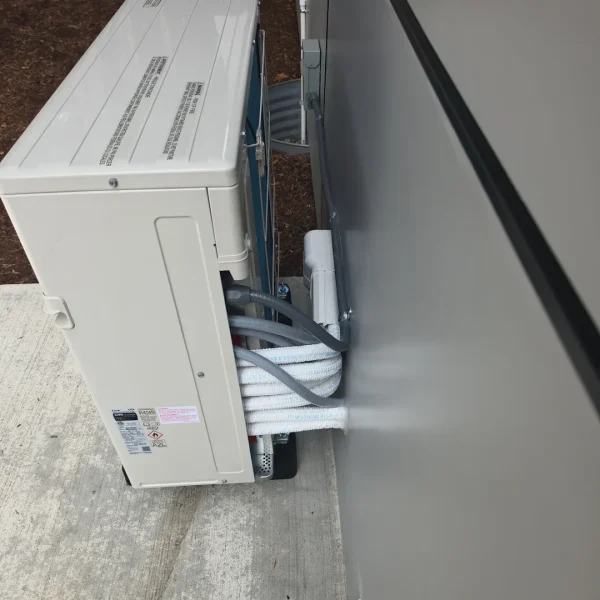 Multi-zone outdoor unit with several line sets entering the wall