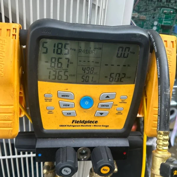 Refrigerant pressure readings taken during a maintenance visit